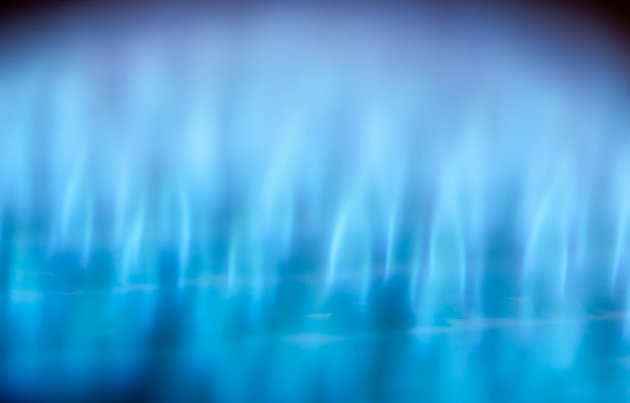 Close-up view of blue flames in gas boiler